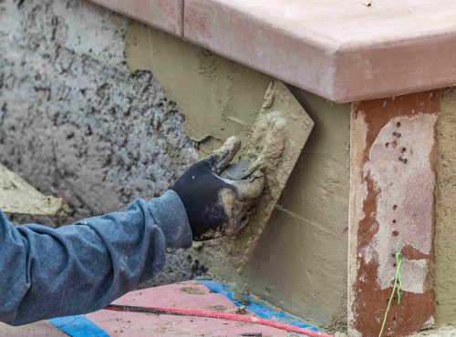 applying-mortar-to-brick-wall-with-trowel-2026-03-09-03-25-51-utc (1)_11zon