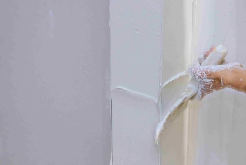 repairing-plaster-wall-at-home-with-trowel-2026-03-09-02-58-45-utc_11zon