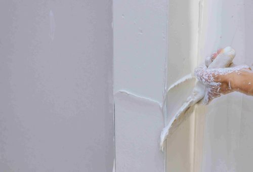 repairing-plaster-wall-at-home-with-trowel-2026-03-09-02-58-45-utc_11zon